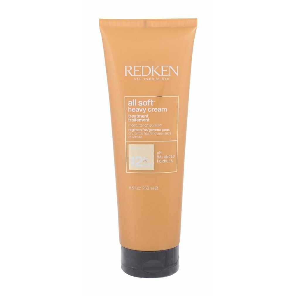Tubo arancione chiaro con tappo nero. Scritta: Redken, All Soft Heavy Cream. Formula pH bilanciata.