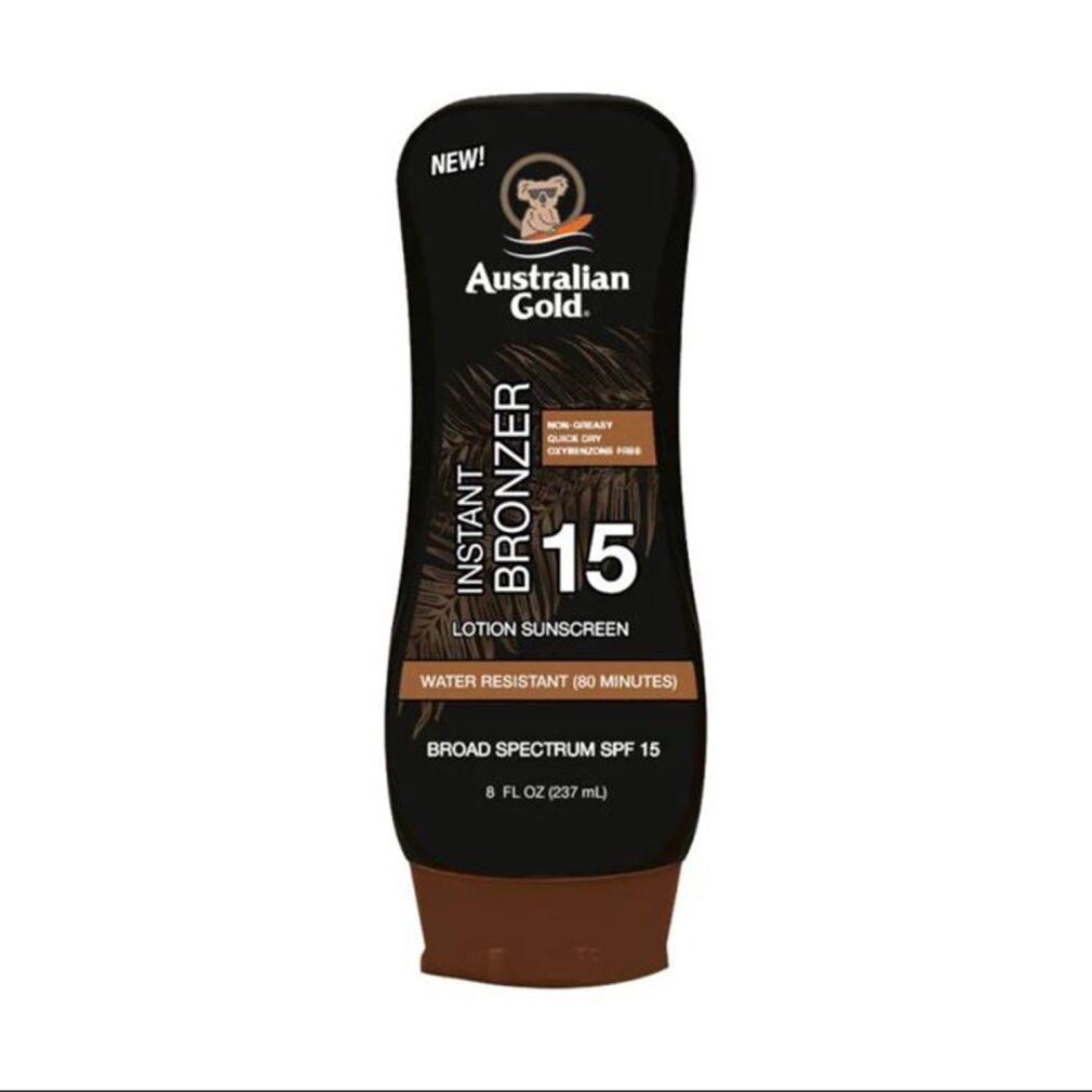 Flacone di lozione abbronzante marrone. Scritta: Instant Bronzer 15, SPF 15. Resistente all'acqua. Marchio: Australian Gold. Tappo nero, base marrone.