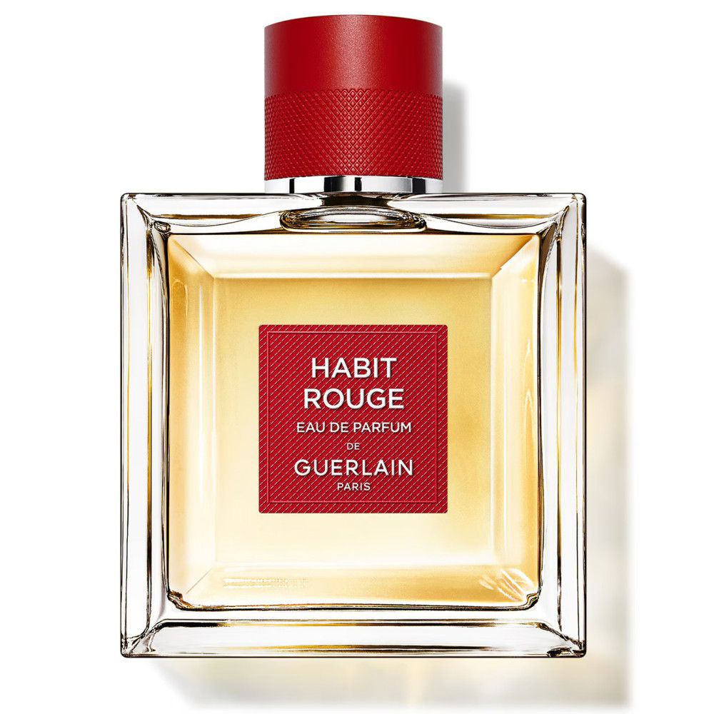 Flacone quadrato in vetro con tappo rosso. Etichetta rossa con testo: Habit Rouge, Eau de Parfum de Guerlain Paris.