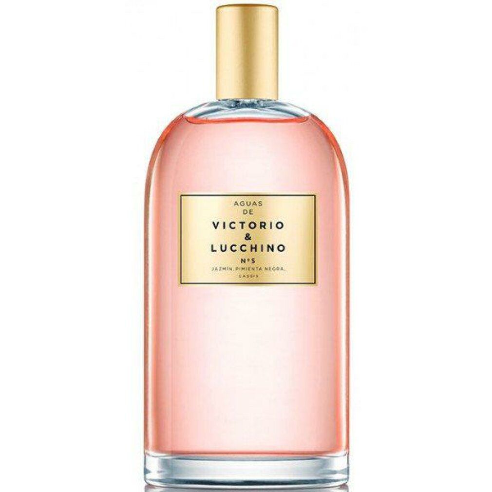 Flacone di profumo con tappo ed etichetta dorati. Scritta: Victorio & Lucchino, N°5. Flacone in vetro trasparente, liquido rosa.