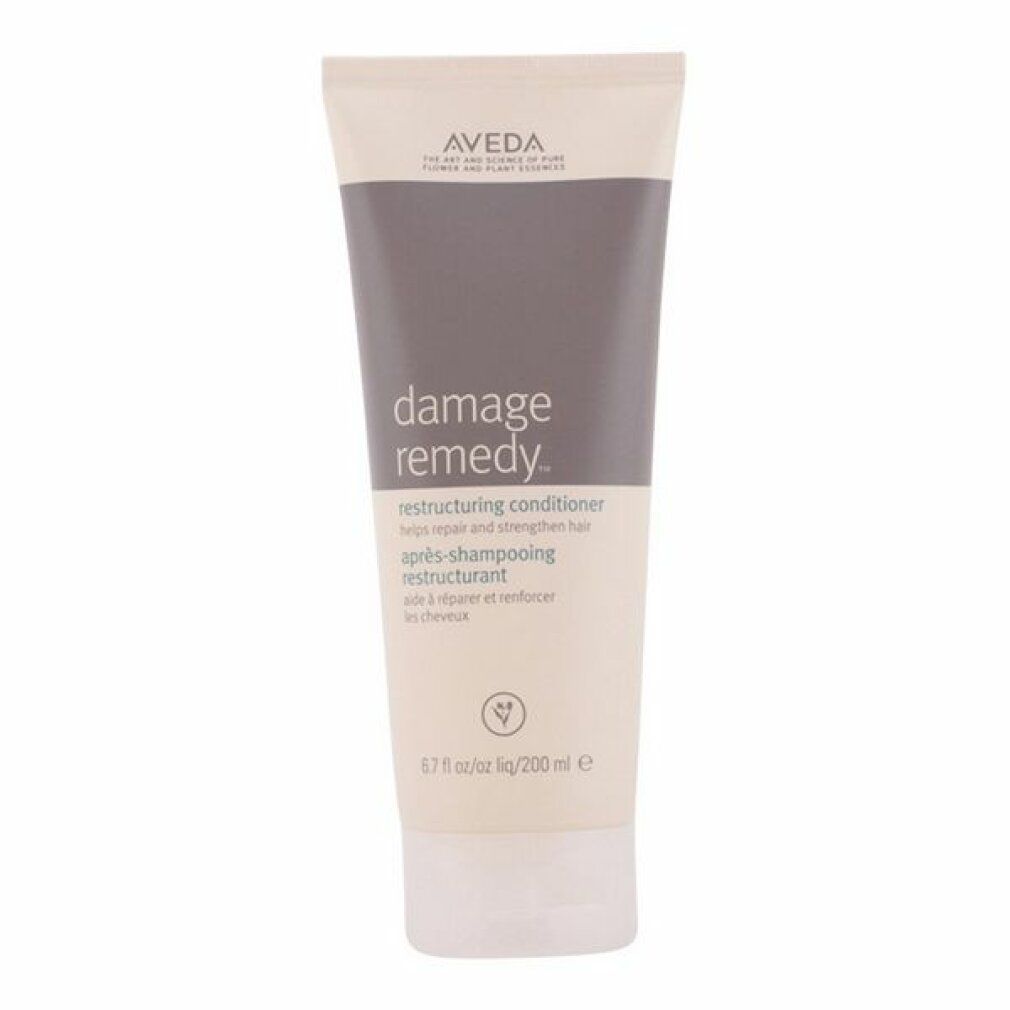 Tubo color crema con tappo grigio. Scritta: Damage Remedy Restructuring Conditioner. Marca: Aveda. 200 ml.