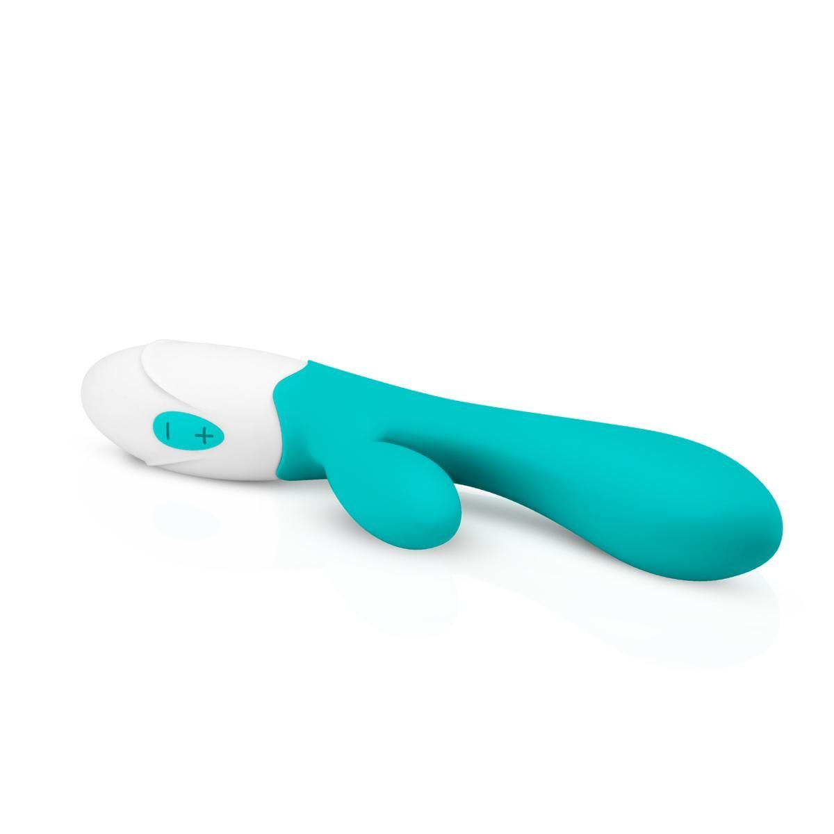 Vibratore turchese e bianco. Forma curva con due sporgenze. Pannello di controllo con pulsanti.