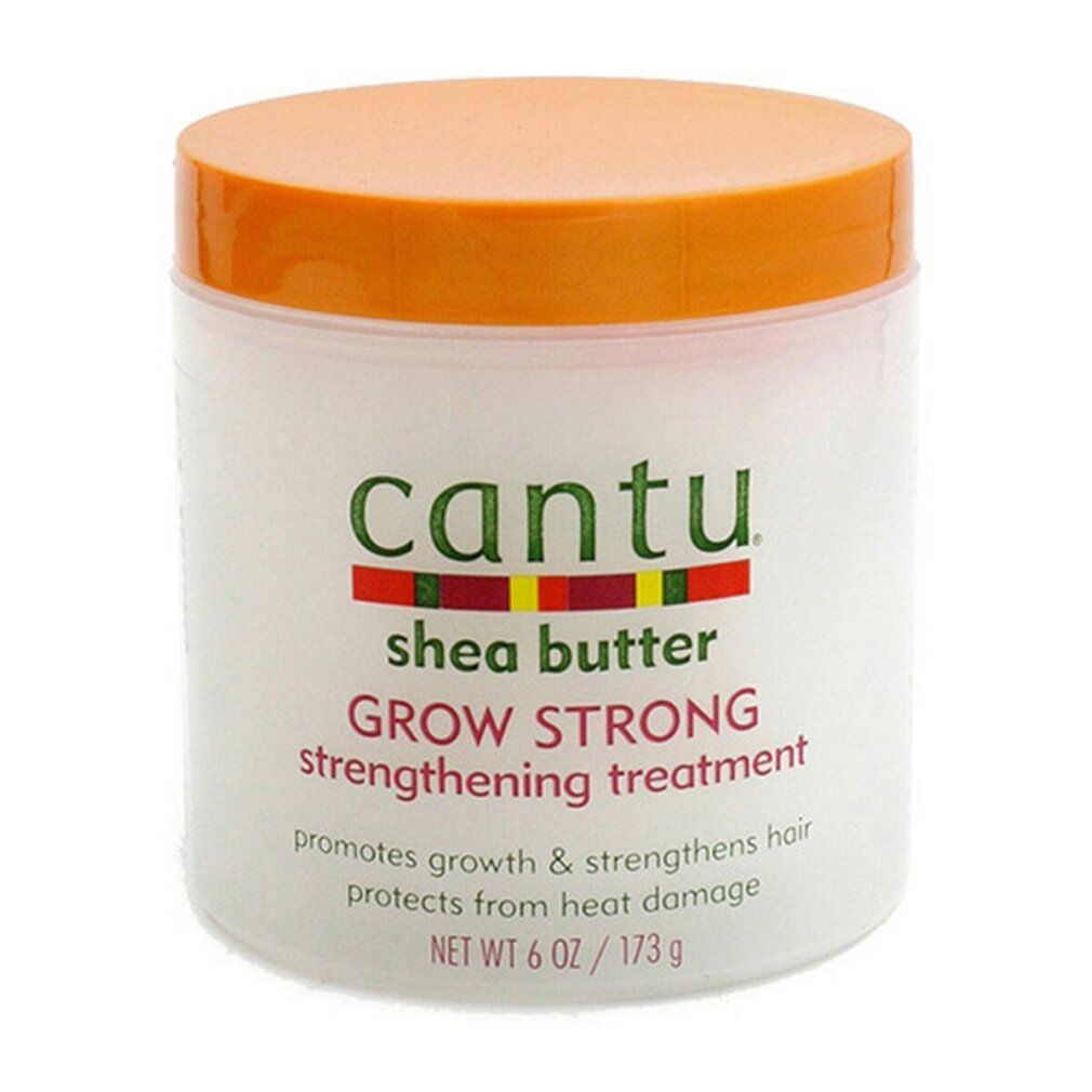 Vaso bianco con coperchio arancione. Scritta: Cantu, Shea Butter, Grow Strong, Strengthening Treatment. Netto 6 OZ / 173 g.