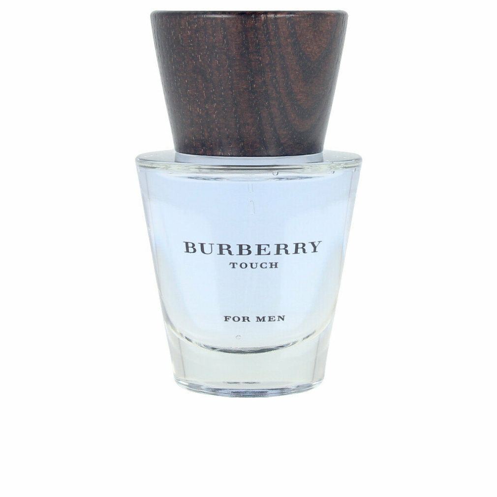 Burberry Touch for Men Eau de Toilette Spray. Flacone in vetro con tappo in legno. Nome del prodotto e logo visibili sul flacone.