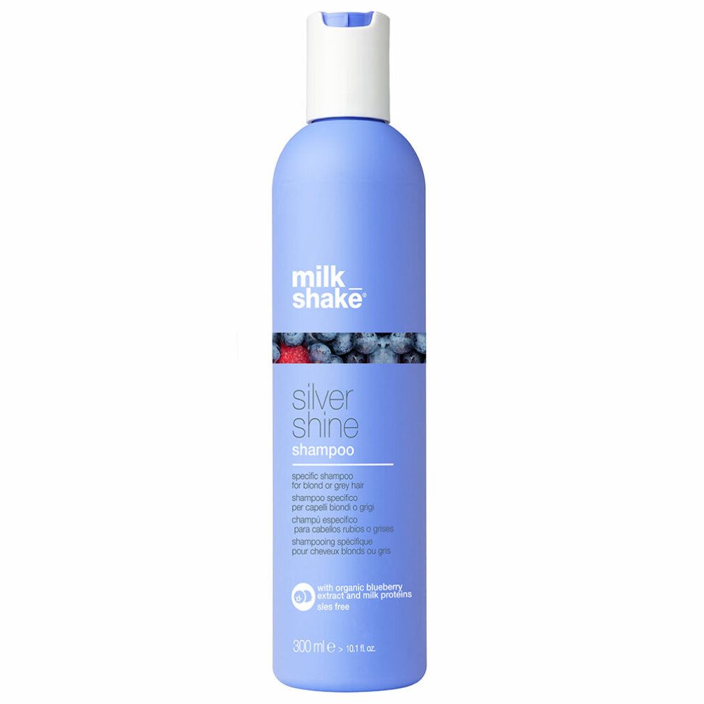 Flacone di shampoo blu con tappo bianco. Scritta: milk_shake, Silver Shine Shampoo. Testo multilingue.