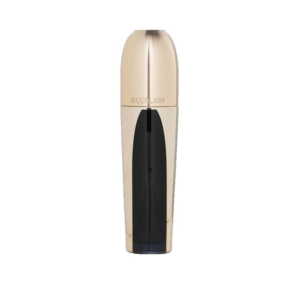 Flacone dorato con contenuto nero. Scritta: GUERLAIN.