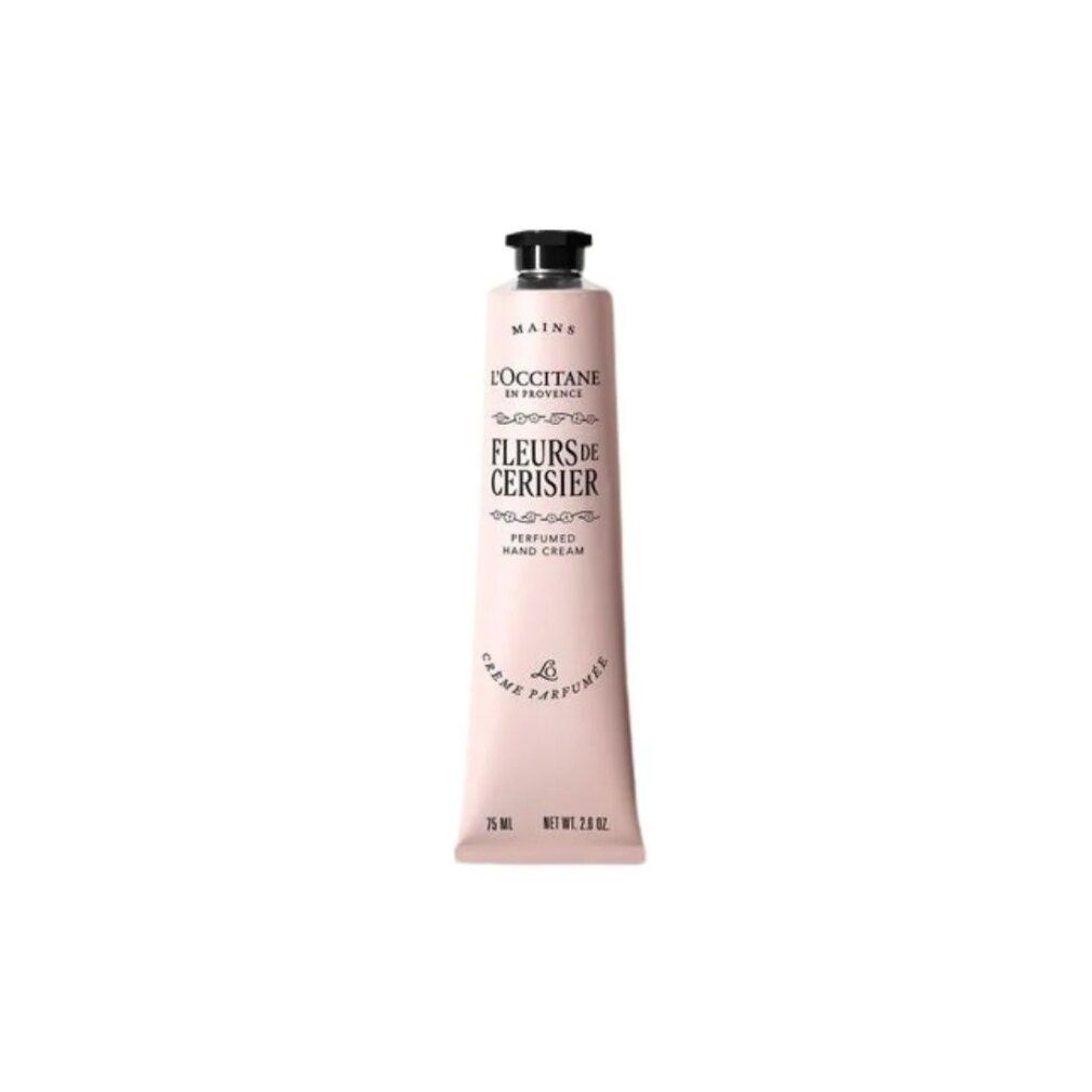 Tubo di crema mani rosa con tappo nero. Scritta: Fleurs de Cerisier, L'Occitane en Provence. In basso: 75 ml, Net Wt 2.6 OZ.