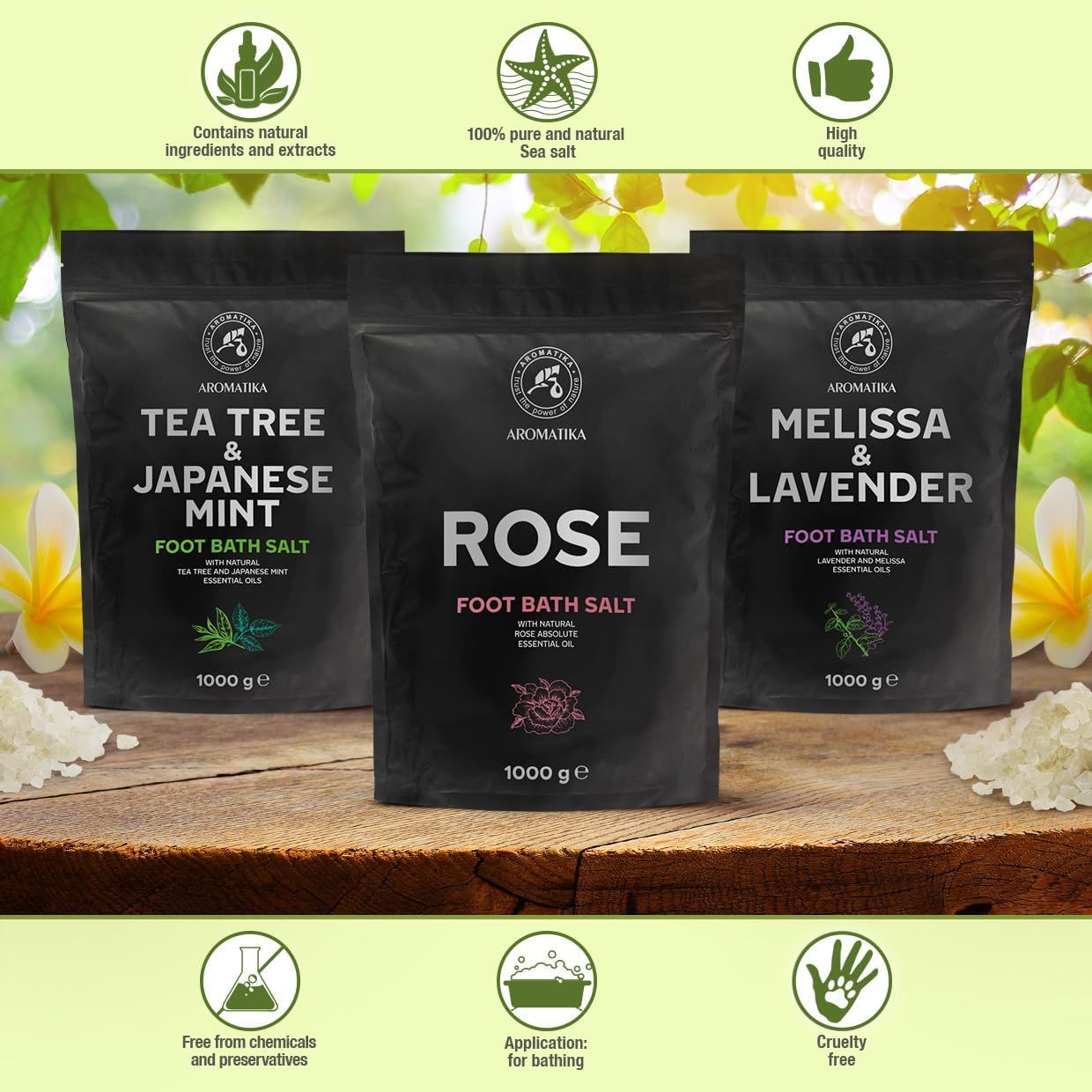 Tre sacchetti neri di sali da bagno per i piedi. Scritte: Tea Tree & Menta giapponese, Rosa, Melissa & Lavanda. Logo: Aromatica. 1000 g. Simboli.