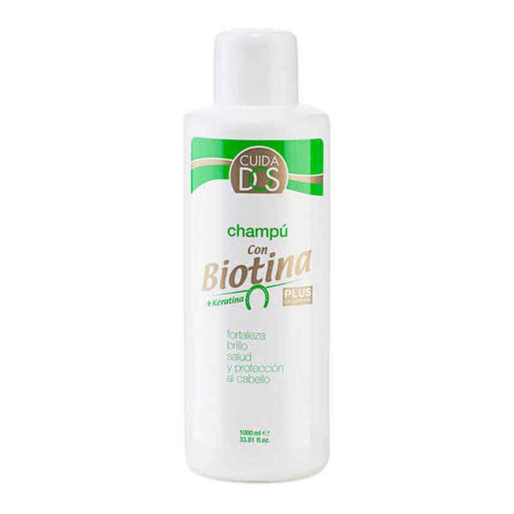 Flacone di shampoo bianco con etichetta verde. Testo: Champú con Biotina, più Cheratina. Contiene testo su forza, lucentezza, salute e protezione.