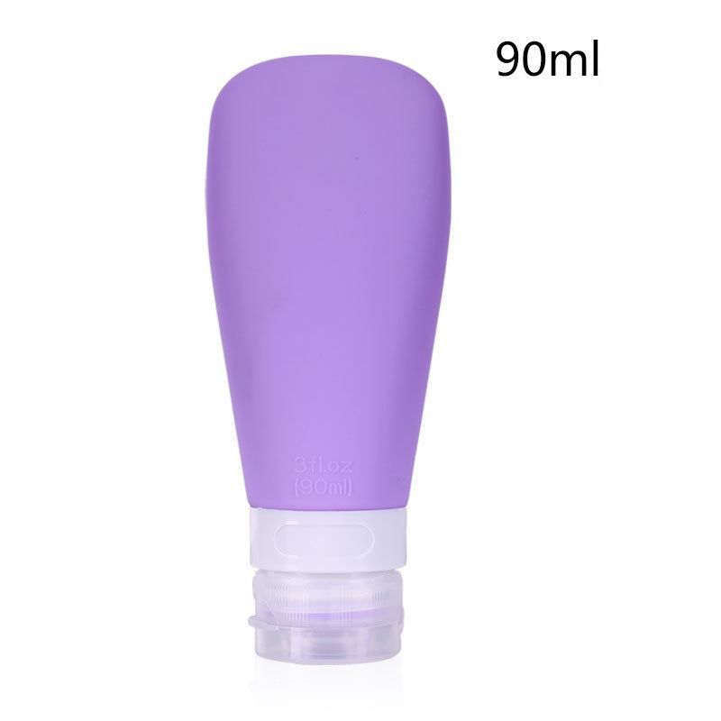 Un singolo flacone da viaggio in silicone viola da 90 ml con tappo bianco e trasparente.