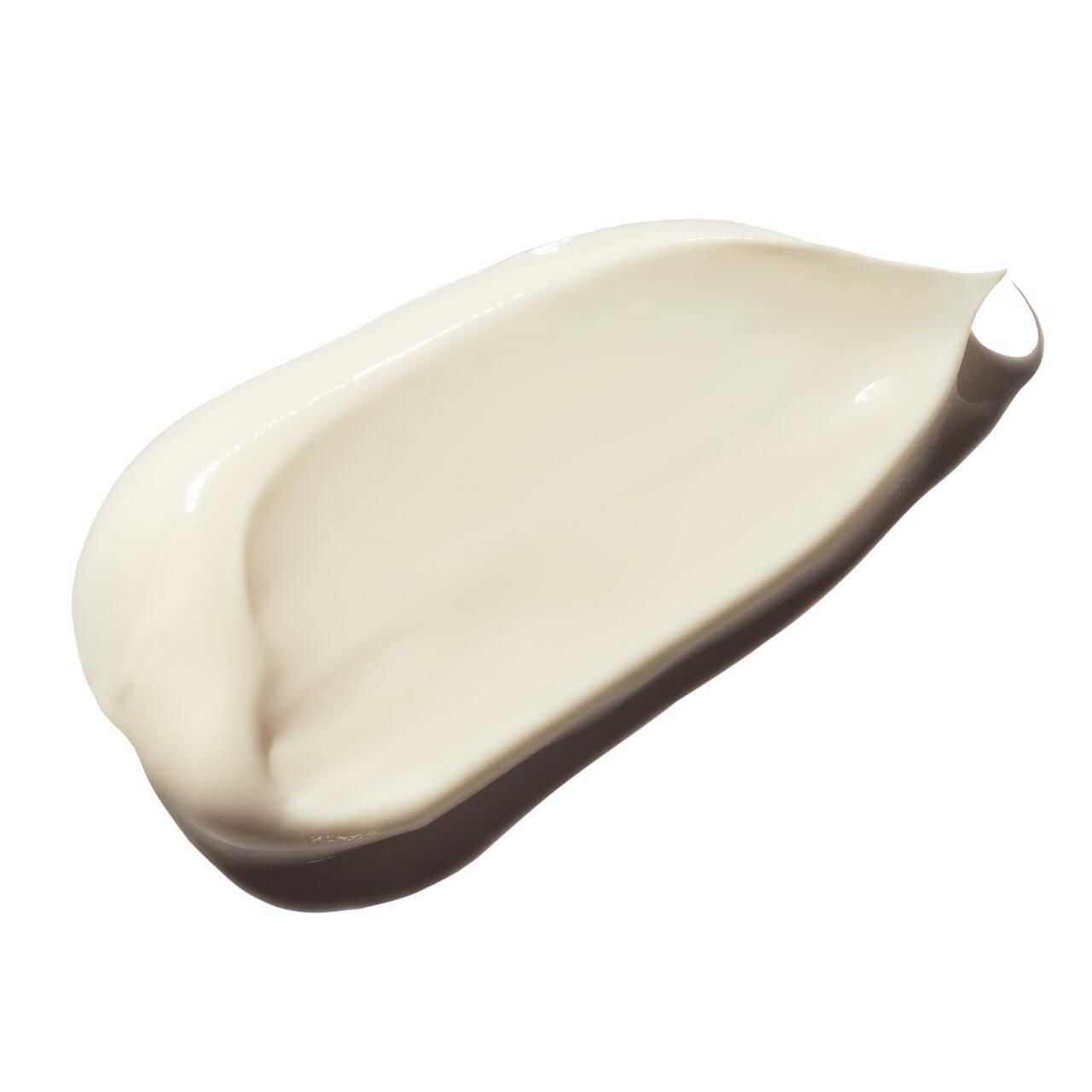 Stesura di crema su sfondo bianco. Texture color crema.