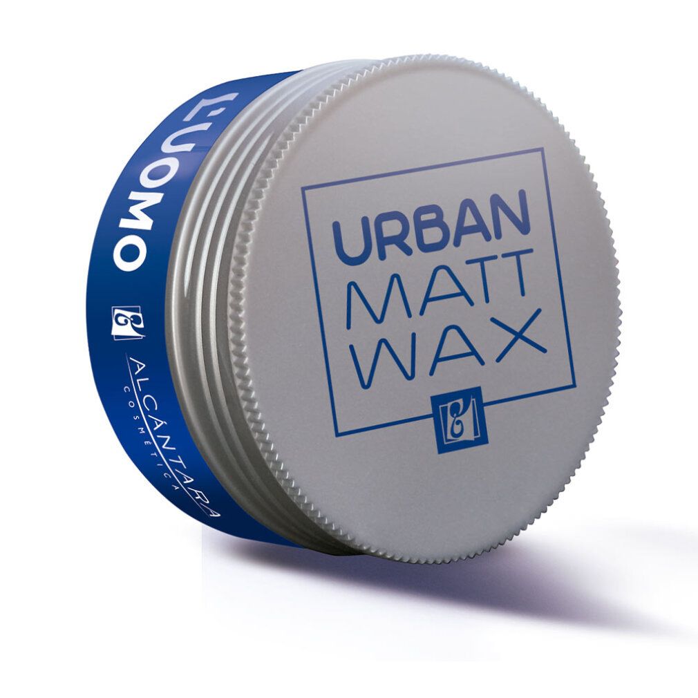 Barattolo rotondo con fascia blu. Scritta "L'UOMO" e "URBAN MATT WAX". Coperchio argentato con testo blu. Marchio Alcántara.
