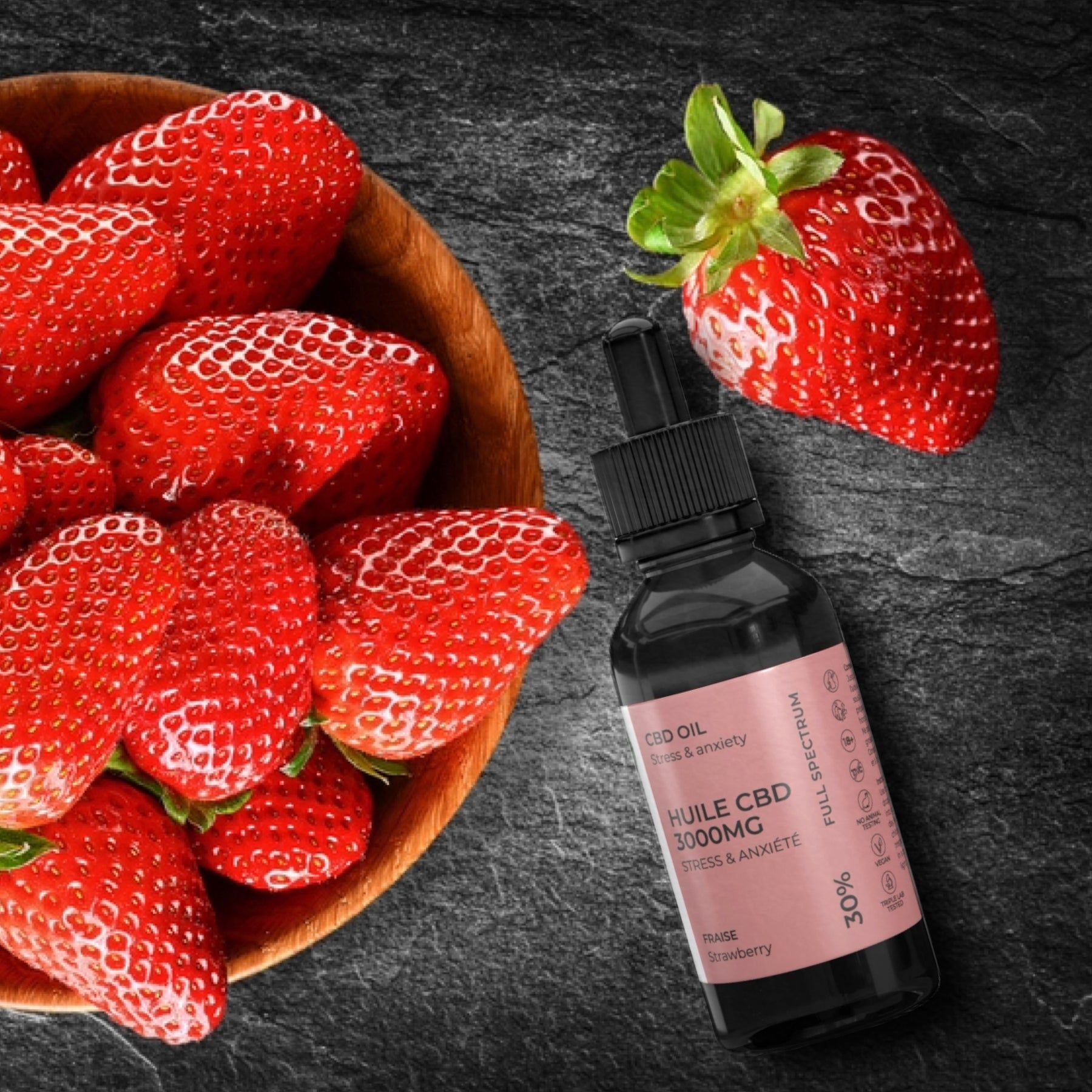 BIOGRINE CBD-ÖL 30% Fragola. Bottiglia con contagocce accanto a fragole in una ciotola. Scritta: HUIL CBD 3000MG, Fraise, 30%.