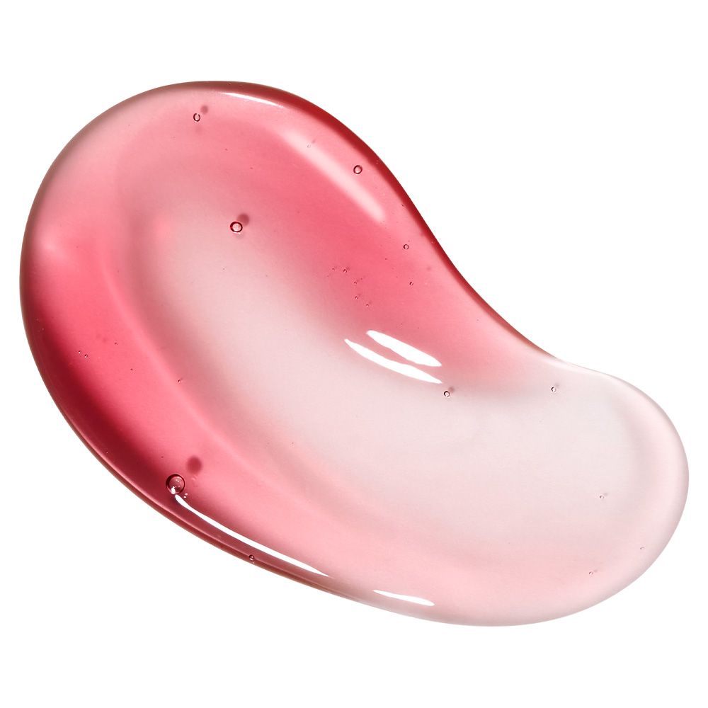 Una texture di siero rosso-rosa con bolle d'aria, distribuita su una superficie liscia.