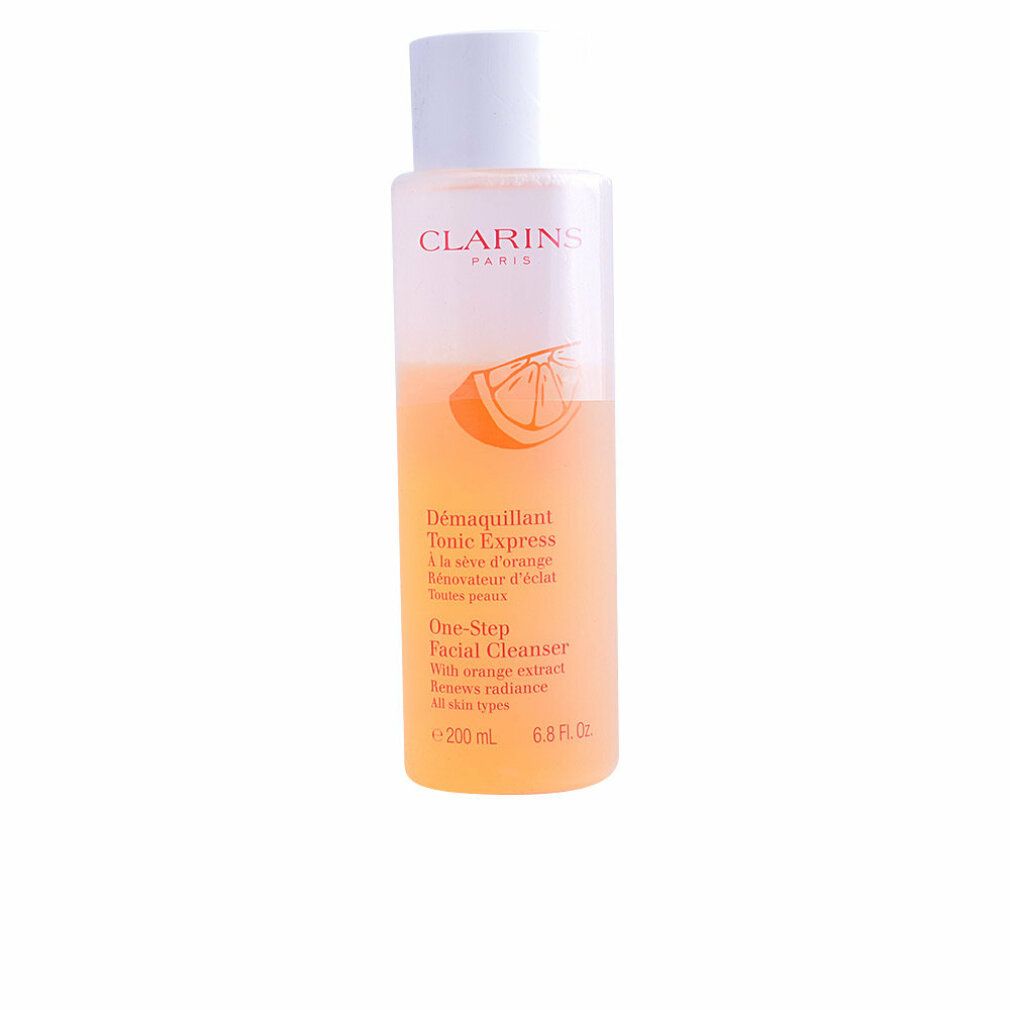 Clarins One-Step Facial Cleanser. Bottiglia con liquido arancione e tappo bianco. Testo: Clarins Paris, Tonic Express, One-Step Facial Cleanser.