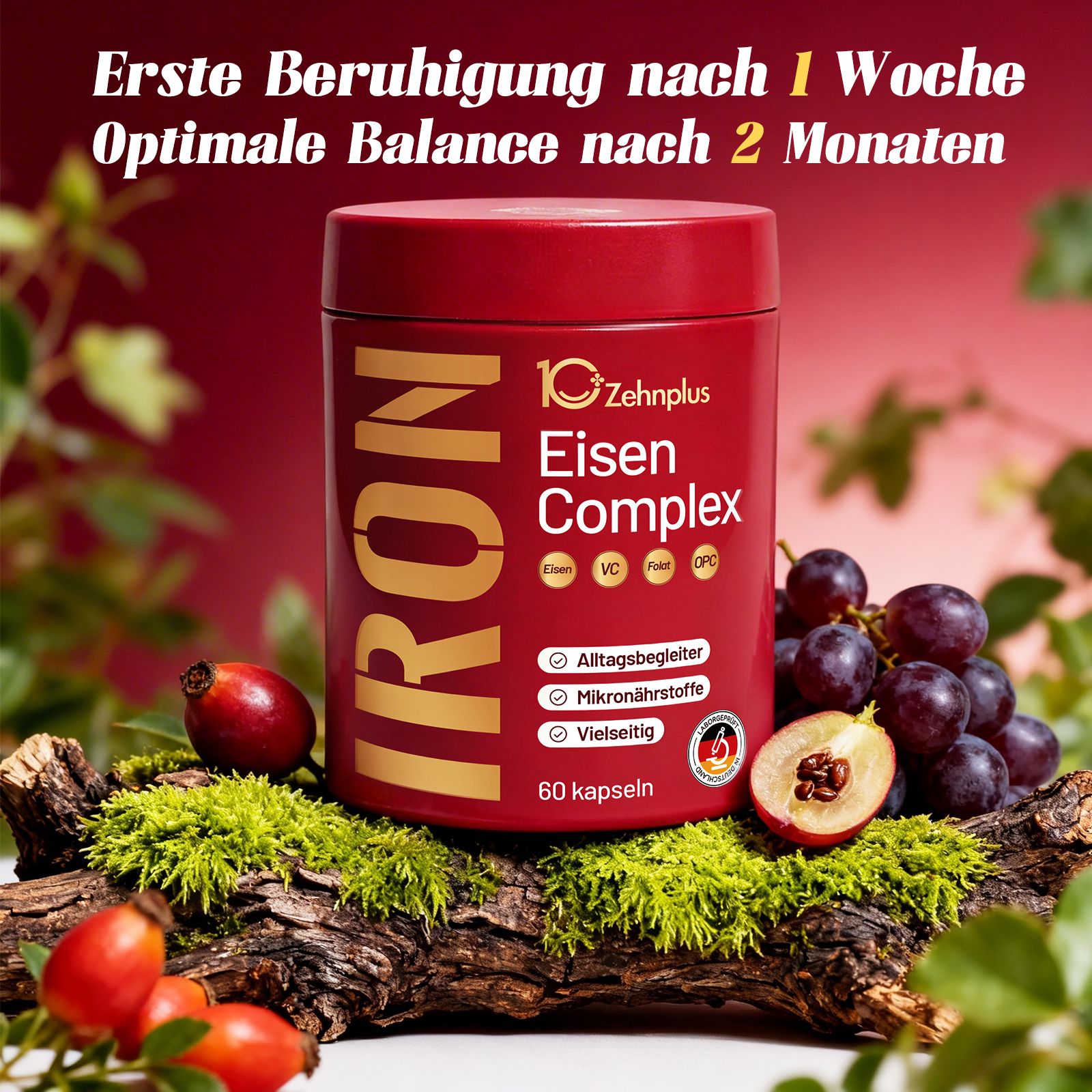 Barattolo rosso "IRON Eisen Complex", 60 capsule. Accompagnato da uva, bacche di rosa canina, muschio.