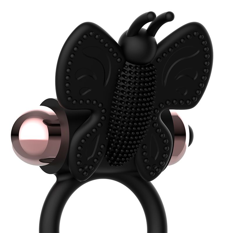 Anello vibrante nero, design a farfalla, elementi oro rosa.
