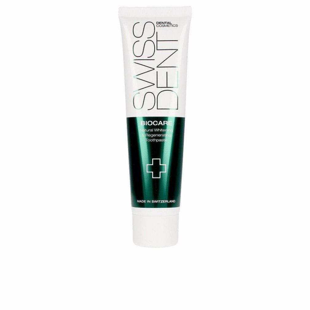 Tubo di dentifricio bianco e verde. Scritte: SWISSDENT, BIOCARE, Natural Whitening, dentifricio. Simbolo croce verde.