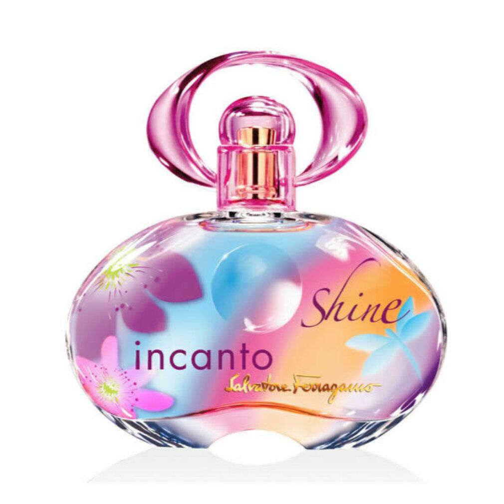 Flacone di profumo rotondo con tappo rosa. Stampa di fiori e scritta: Incanto Shine. Vaporizzatore dorato.