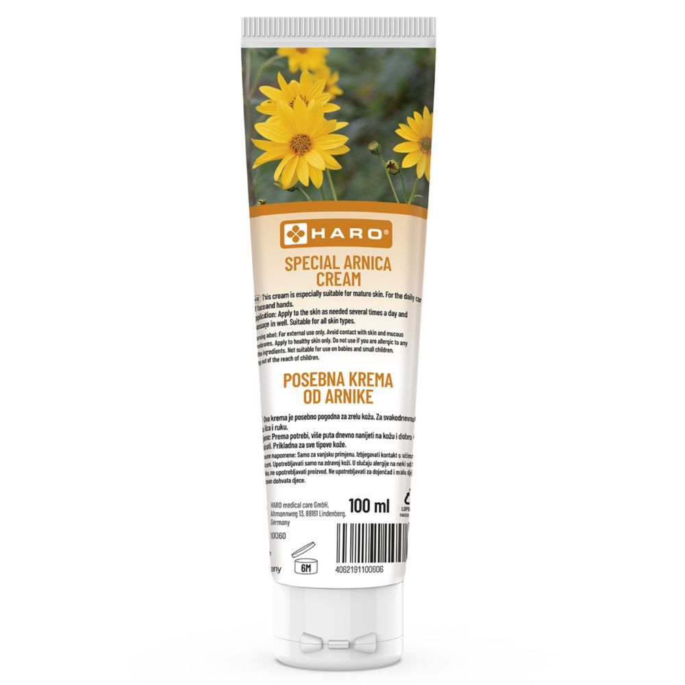 Tubo di crema con fiori gialli e testo. Testo: Haro Special Arnica Cream. 100 ml. Tappo bianco.