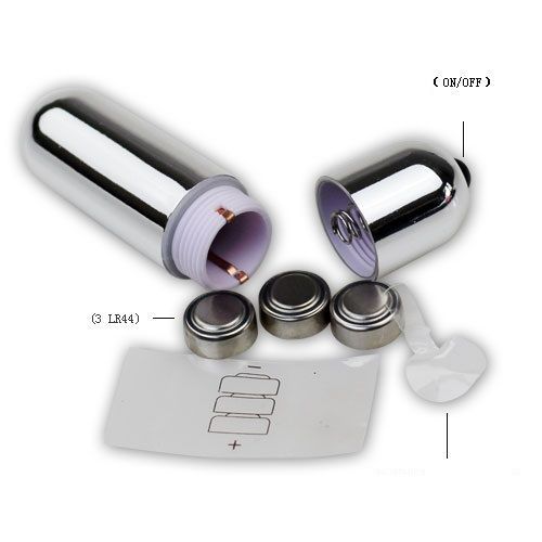 Vibratore argentato, smontato. Contiene batterie (3 LR44). Con istruzioni e vano batterie.