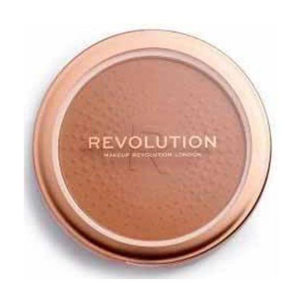 Bronzer rotondo in un contenitore dorato. Scritta REVOLUTION. Superficie puntinata.