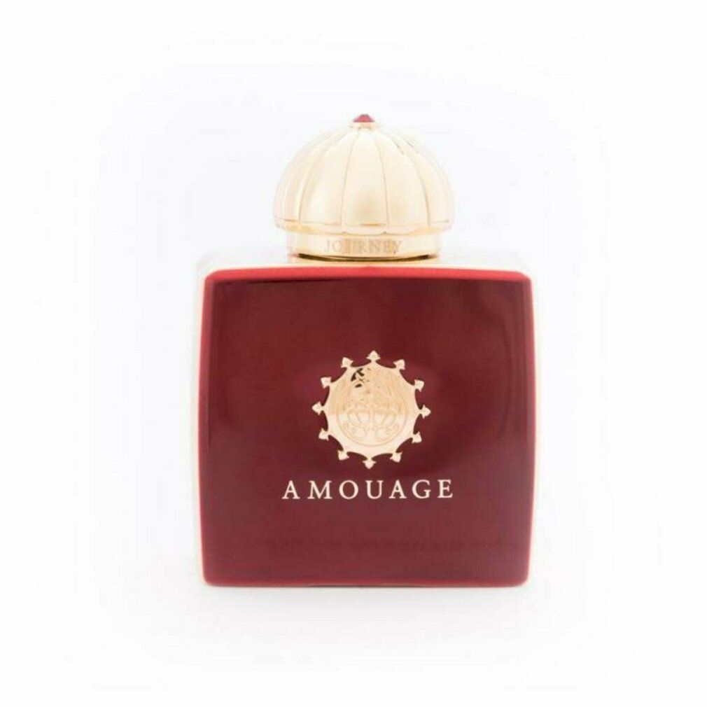 Flacone rosso con tappo dorato. Scritta: Amouage.