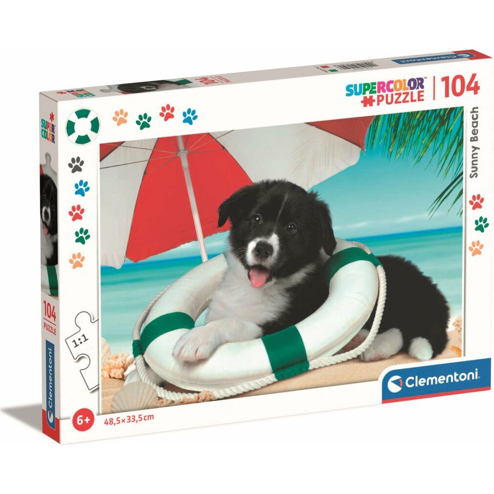 Clementoni Sonnenstrand-Puzzle 104 pezzi. Confezione con motivo puzzle: cane nel salvagente sulla spiaggia.