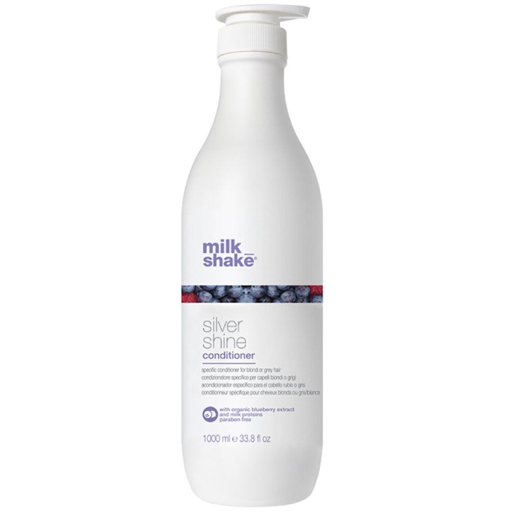 Flacone bianco con dosatore. Scritta: milk_shake Silver shine conditioner. Contiene estratto di mirtillo. 1000 ml.