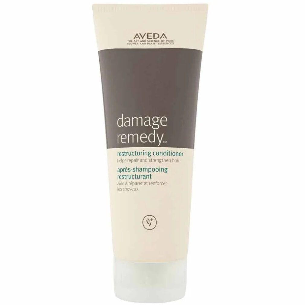 Tubo color crema con tappo grigio. Scritta: Damage Remedy Restructuring Conditioner. Marca: Aveda. 200 ml.