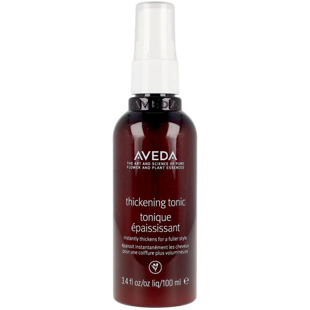 Flacone marrone scuro con vaporizzatore bianco. Scritta: Aveda, thickening tonic, tonique épaississant. 3.4 fl oz/100 ml.