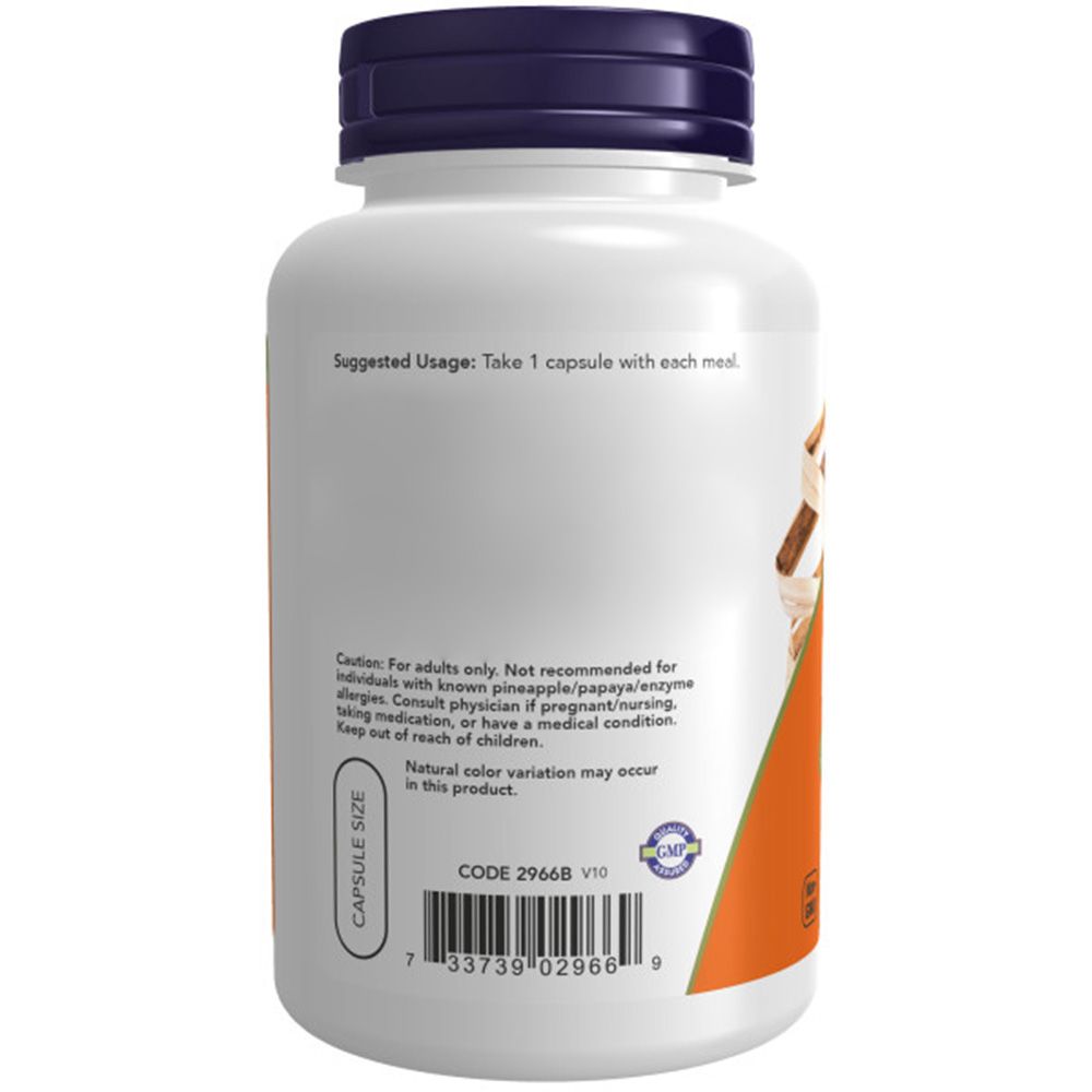 Flacone bianco con tappo blu. Etichetta arancione. Scritta: Capsule Size. Codice a barre. Testo: Suggested Usage: Take 1 capsule with each meal.