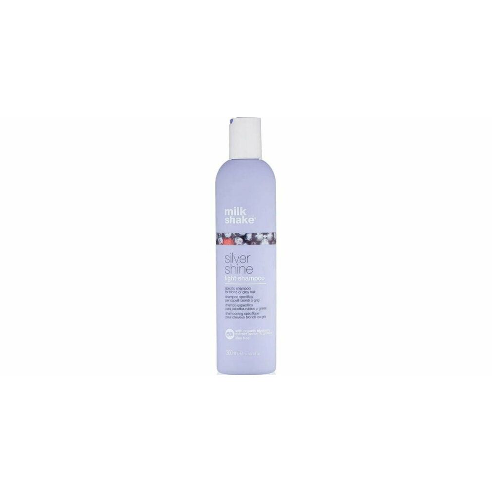 Flacone di shampoo lilla con tappo bianco. Scritta: milk_shake, Silver Shine light shampoo. 250 ml.
