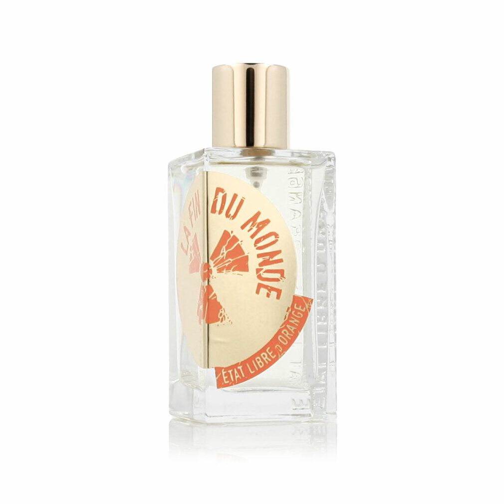 Flacone di profumo con tappo dorato. Scritta: Du Monde, Etat Libre d'Orange. Etichetta con design arancione.