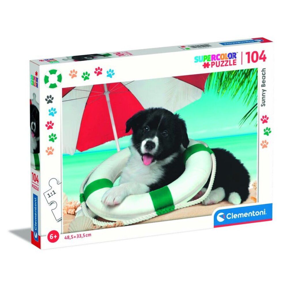 Clementoni Sonnenstrand-Puzzle 104 pezzi. Confezione con motivo puzzle: cane nel salvagente sulla spiaggia.