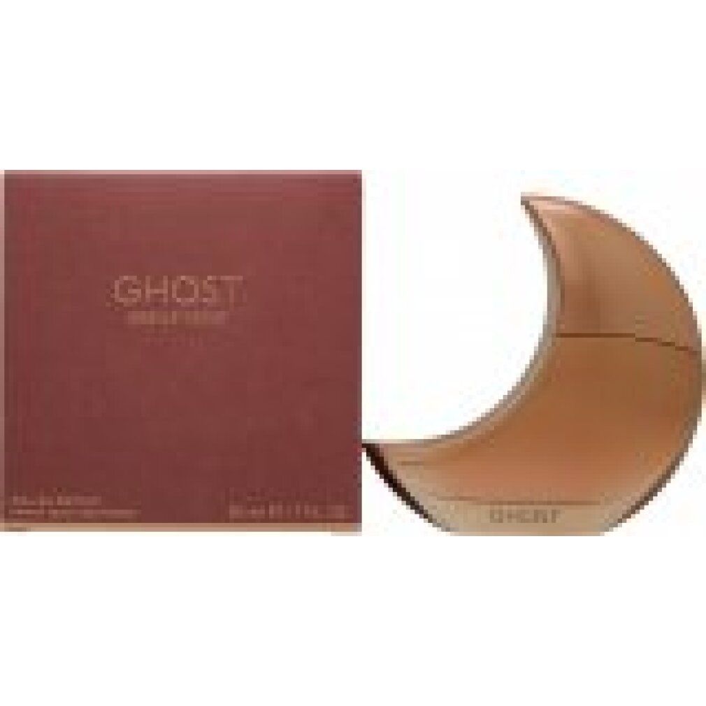 Flacone di profumo a forma di luna e confezione rettangolare. Confezione con scritta "GHOST". Flacone e confezione in tonalità oro rosa.