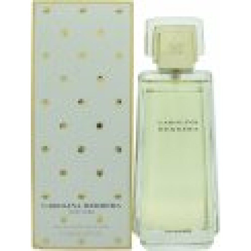 Flacone e confezione Carolina Herrera Femme EdT. Scatola bianca a pois dorati. Flacone trasparente.