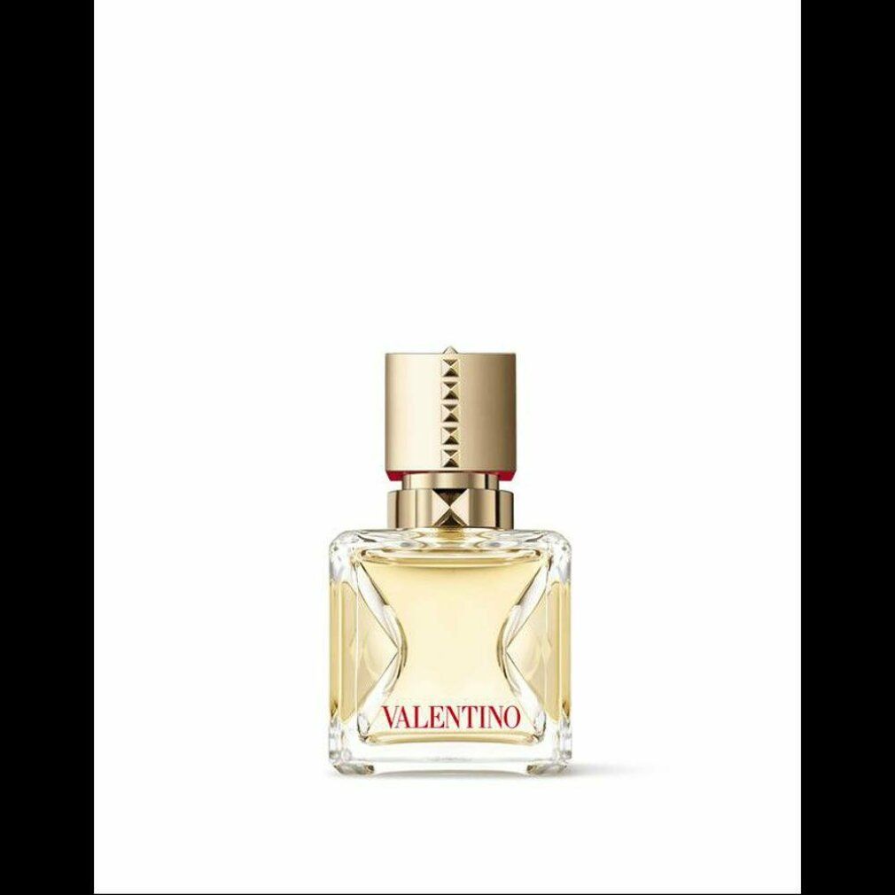 Flacone quadrato con tappo dorato. Profumo trasparente.