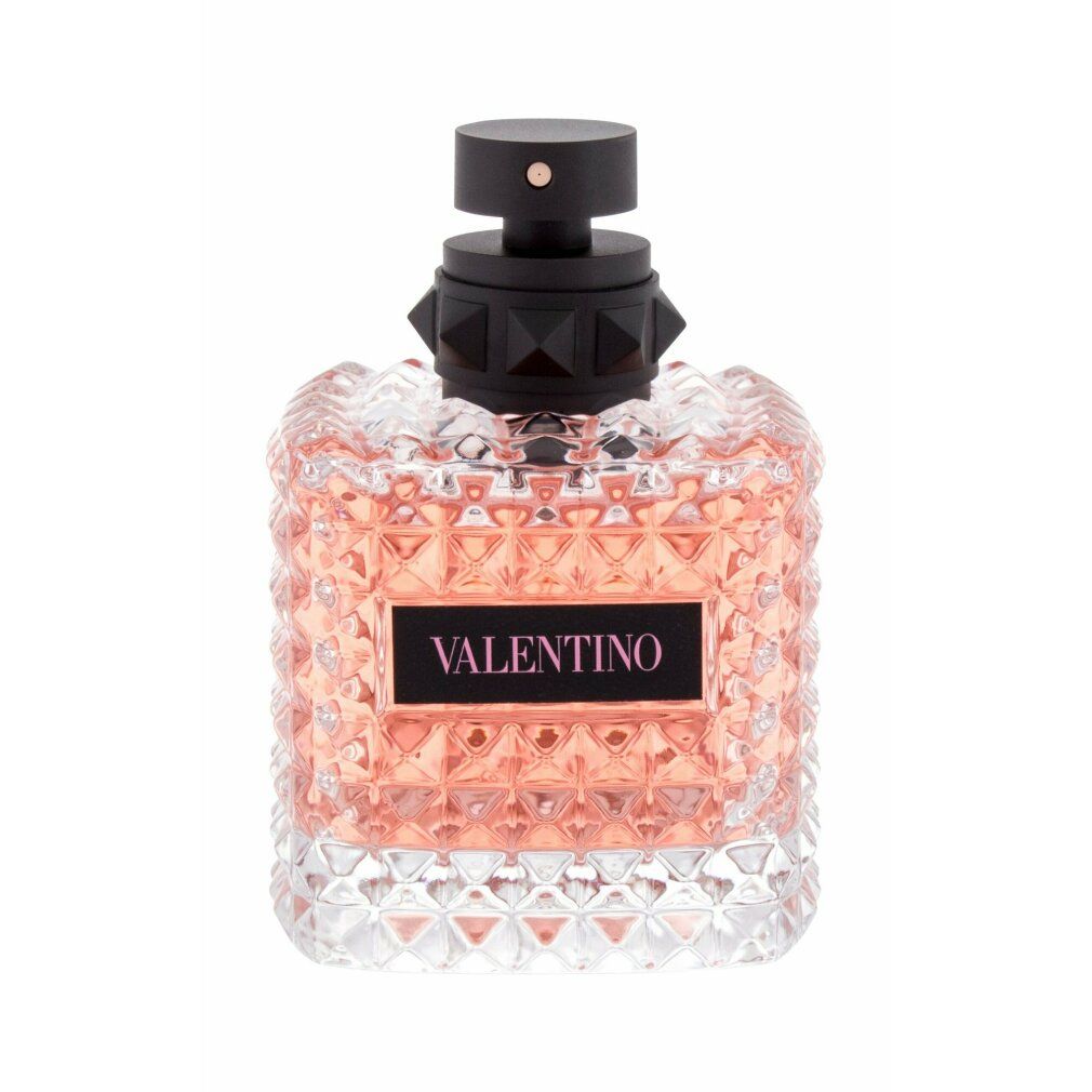 Flacone di profumo con liquido rosa. Tappo nero borchiato. Scritta VALENTINO.