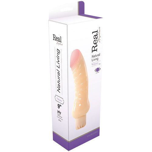 Prodotto in confezione. Dildo beige con punta rosa, in scatola bianca. Testo: Real, Natural Living, Vulcano.