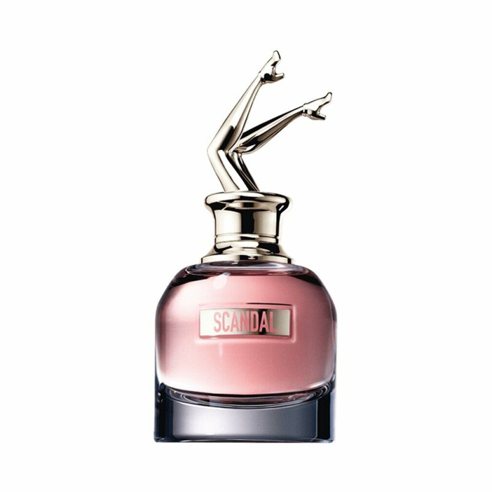 Flacone di profumo. Flacone in vetro con gambe dorate come tappo. Scritto: SCANDAL.