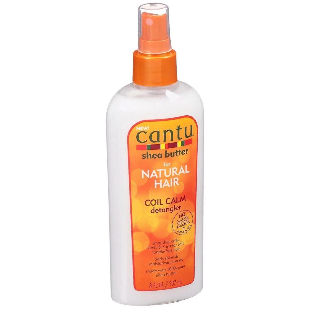 Cantu Coil Calm Detangler. Flacone bianco con erogatore arancione. Etichetta prodotto con testo.