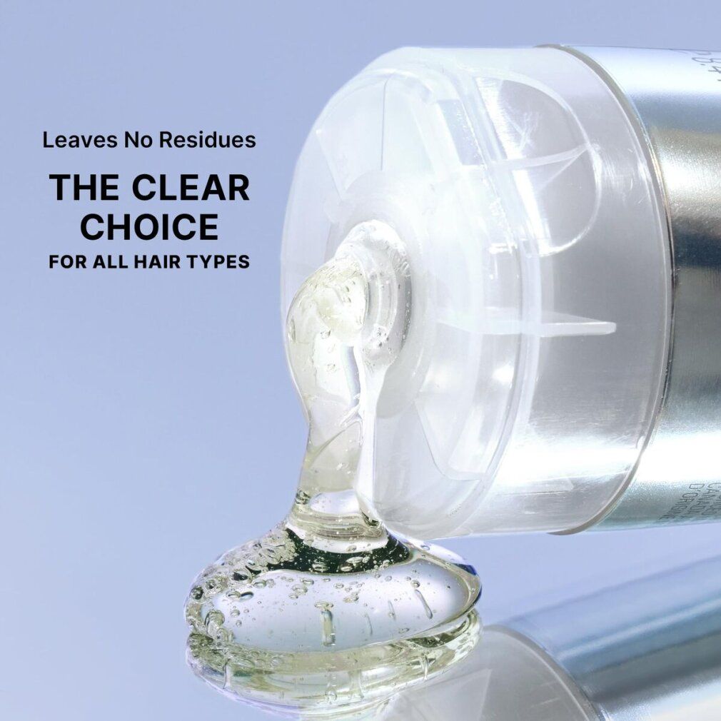 Shampoo versato da un tubo. Liquido chiaro e gelatinoso. Testo: "THE CLEAR CHOICE FOR ALL HAIR TYPES".