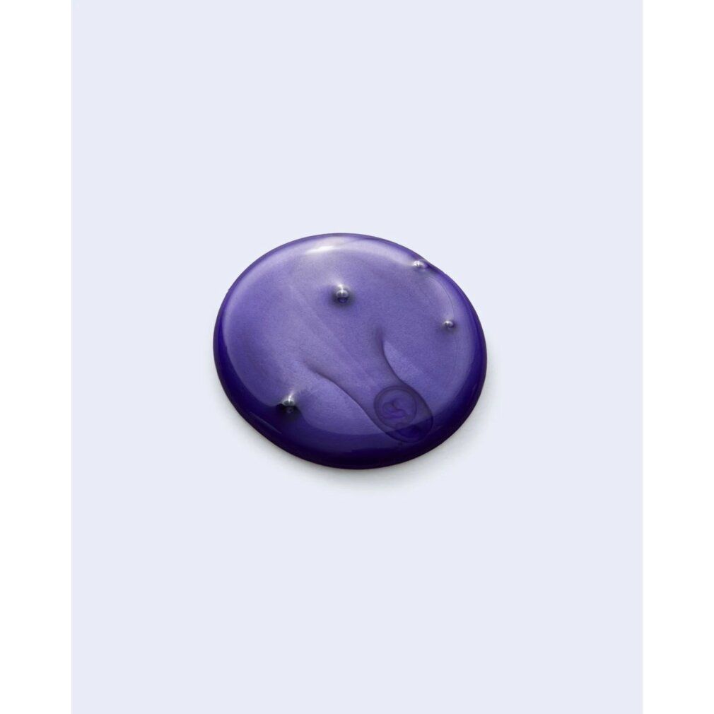 Primo piano di una goccia viola. Nessuna denominazione del prodotto visibile.