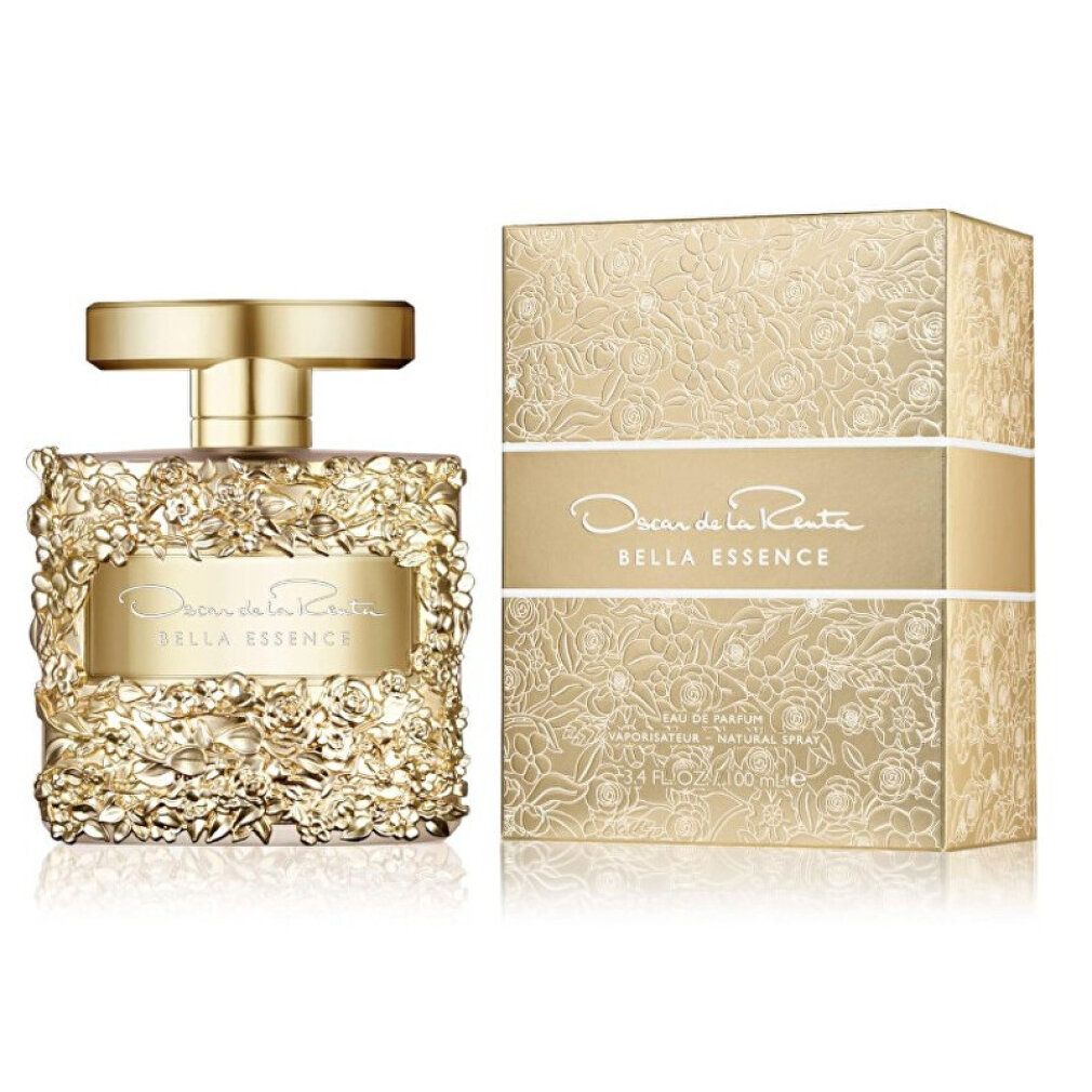 Flacone e scatola dorati. Scritta: Oscar de la Renta Bella Essence. Confezione a motivi floreali.