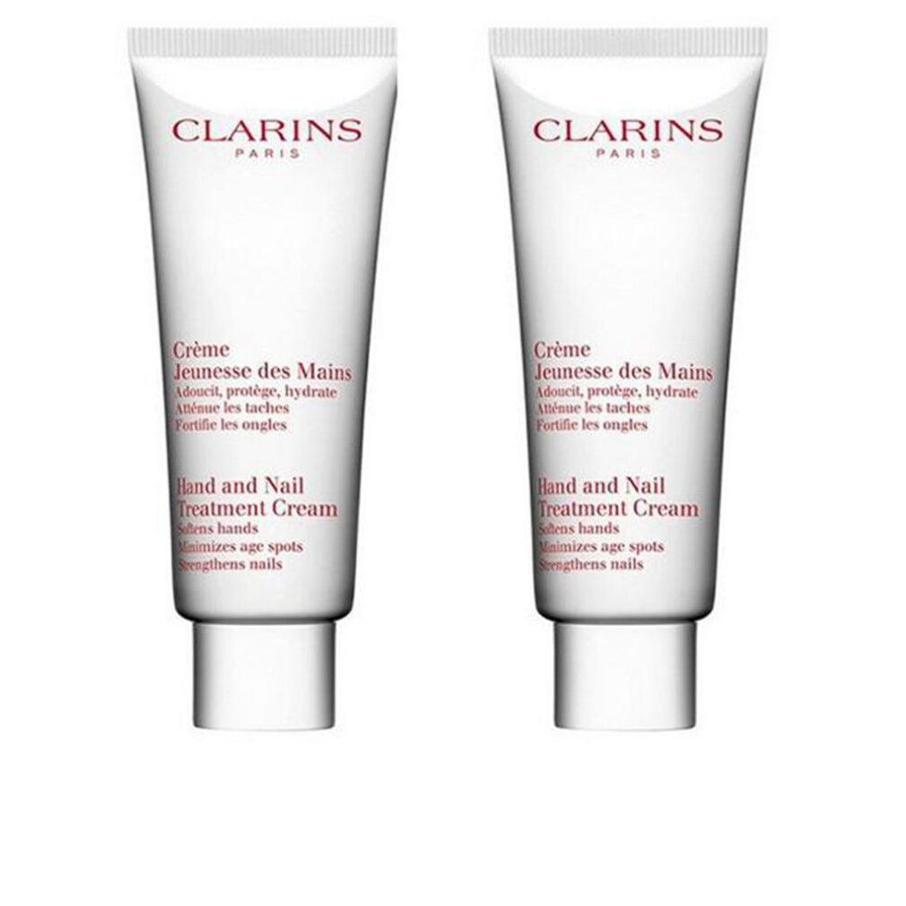 Due tubi di Clarins Crème Jeunesse des Mains. Bianchi, testo rosso. Hand and Nail Treatment Cream.