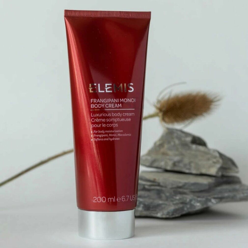 Tubo rosso con testo. Elemis Frangipani Monoi Body Cream. 200 ml. Scritta: Luxurious body cream.