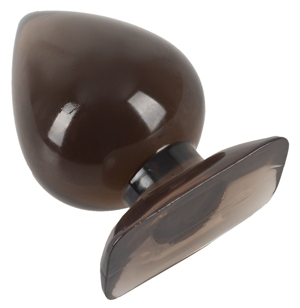 Anal plug, marrone sfumato, a forma di goccia. Punta e base più scure. Superficie liscia. Base ampia. Appoggiato su un lato.
