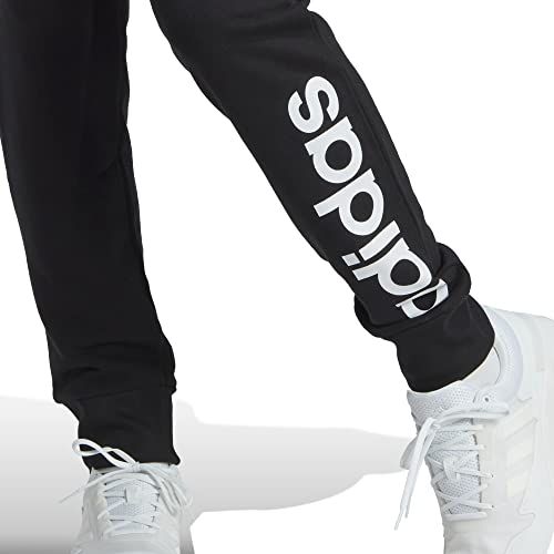 Pantalone Adidas nero con scritta logo bianca sul lato.