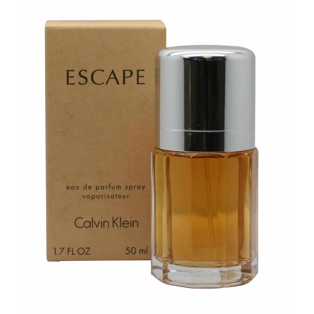 Flacone di profumo e confezione. Scritta: ESCAPE, Calvin Klein. Flacone con tappo argentato, liquido dorato. 1.7 FL OZ, 50 ml.